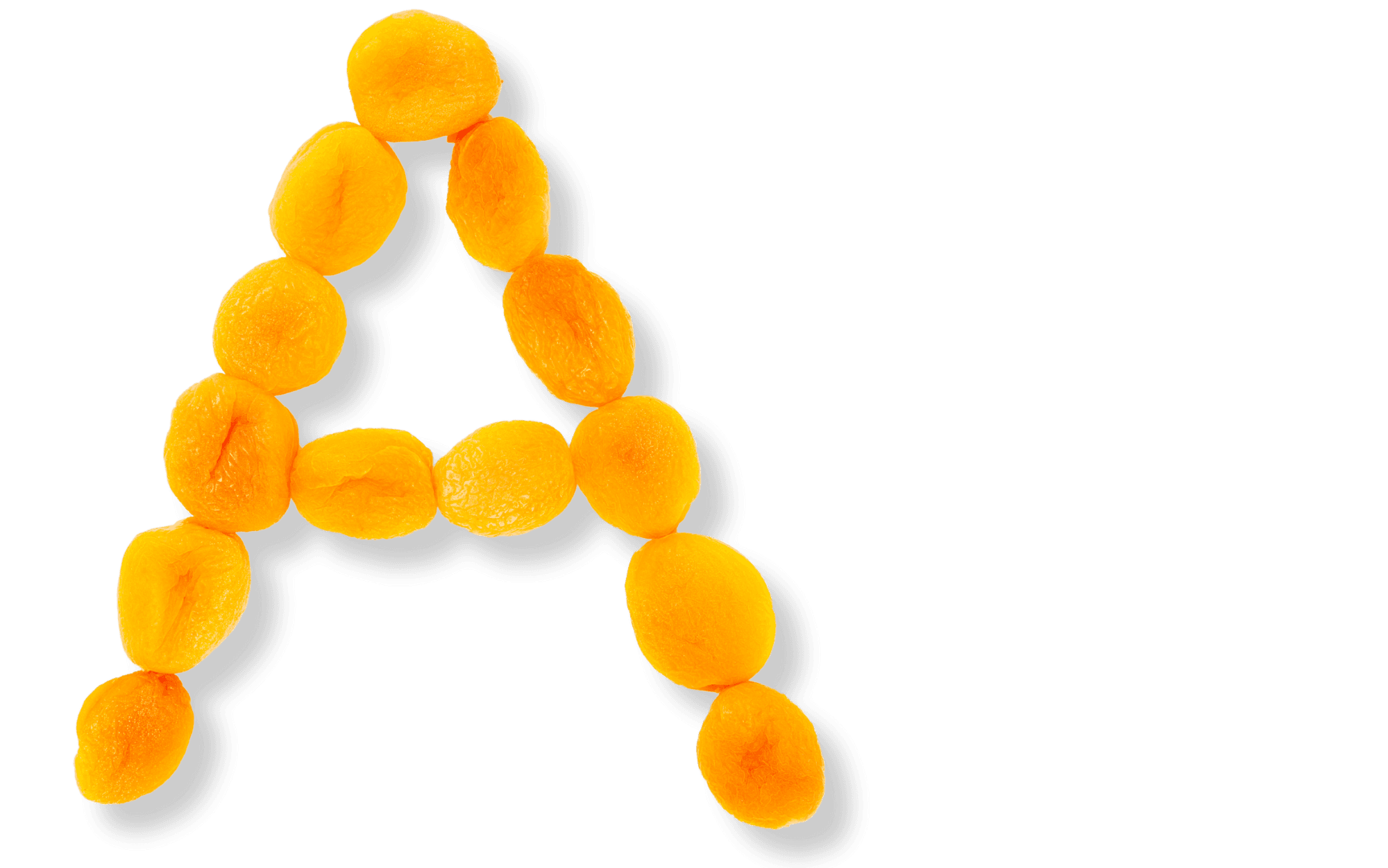 Torkade aprikoser som bildar bokstaven A, vilket är en bra källa till vitamin A